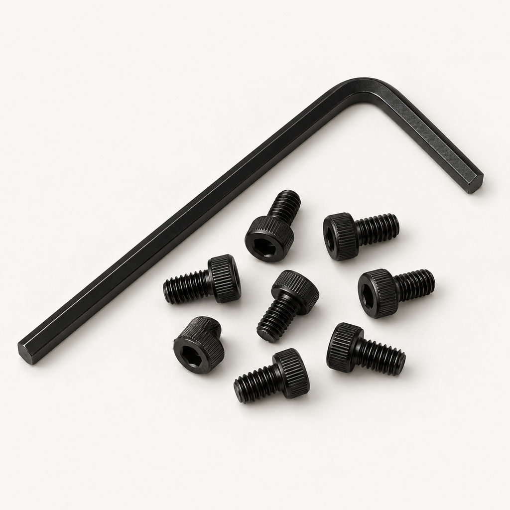 Overhead view of a black 2.5 mm hex key lying diagonally above eight loose black M3 socket head screws