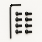 Slabster EXO Hardware Kit: one black 2.5 mm hex key beside eight black M3 socket head screws laid out in two rows of four