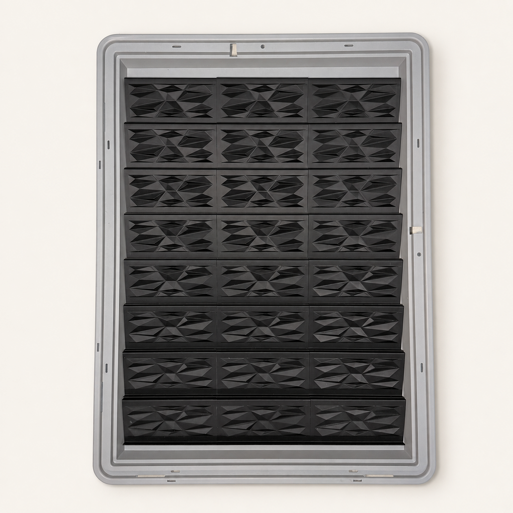 24 black faceted risers with triangular panels inside a gray Zion display case