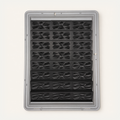 Top-down view of 24 black faceted risers in three columns inside a gray Zion display case