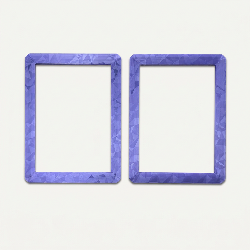 Purple holographic toploader guard opened into its two halves, outer faces up