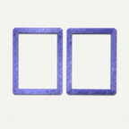 Purple holographic toploader guard opened into its two halves, outer faces up