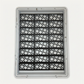 Top-down view of 24 black Featherlite risers with an open lattice pattern inside a gray Zion display case